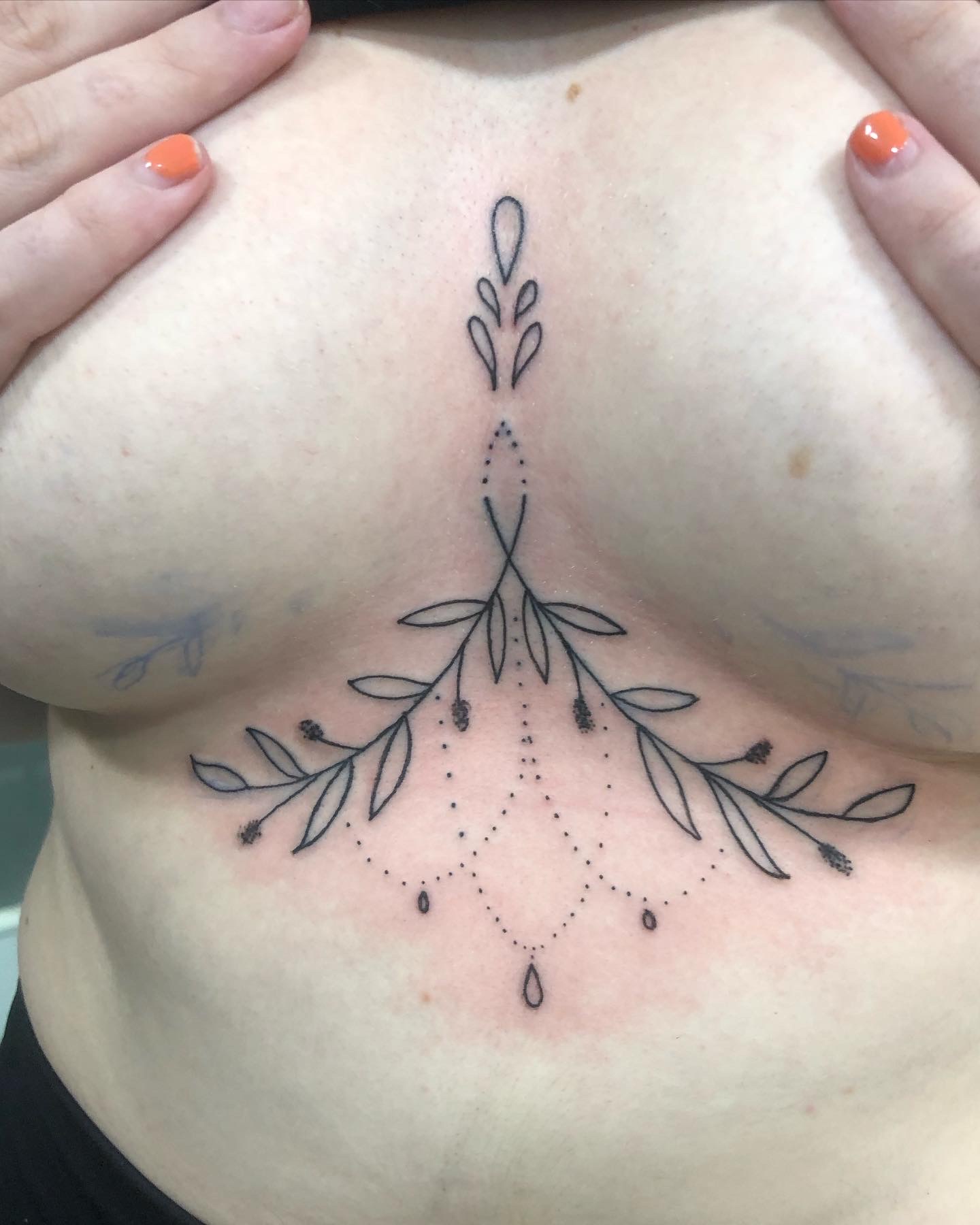 Fine line ornamental sternum tattoo by Rondon Neto