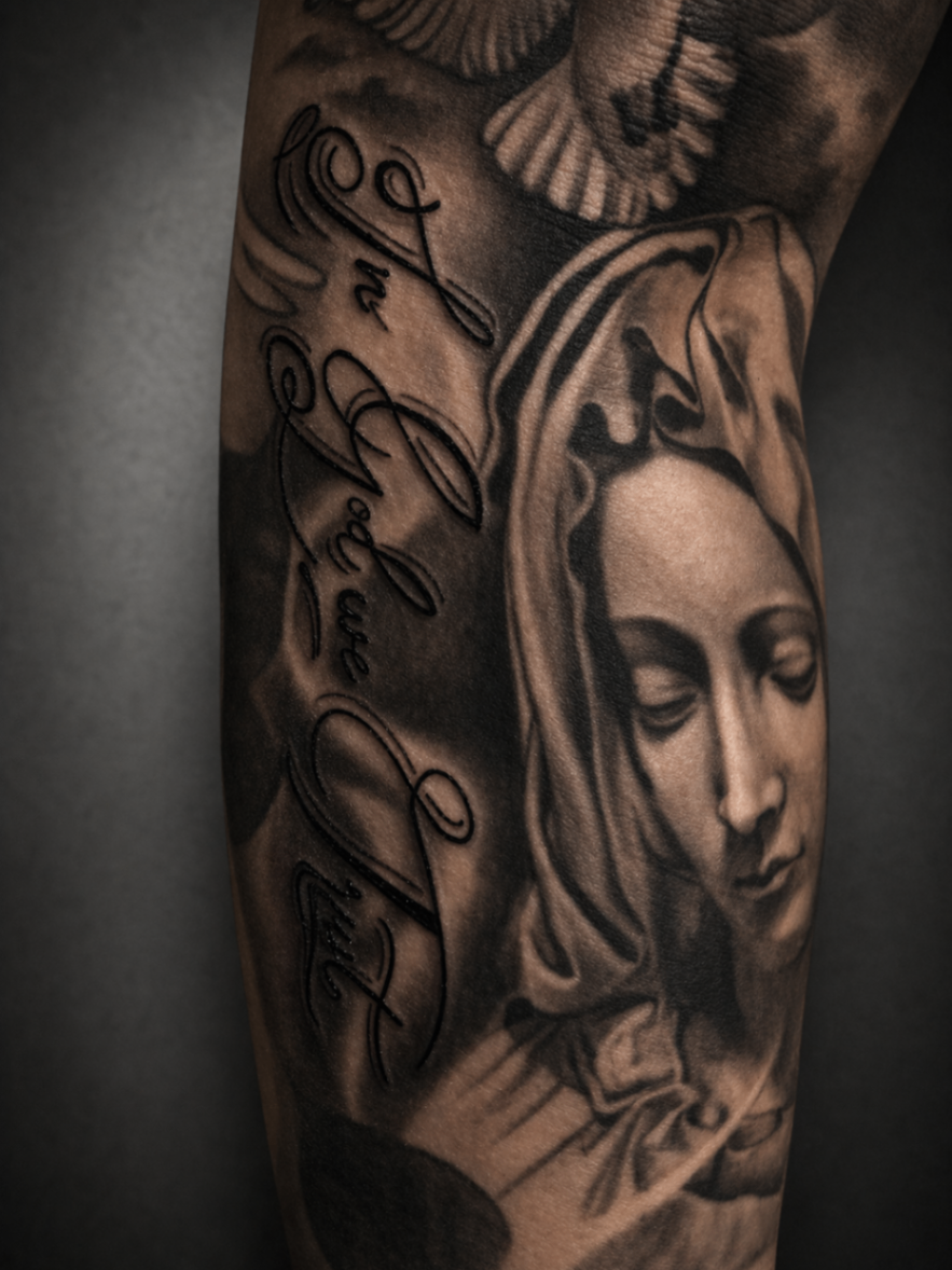 Black and grey religious sleeve tattoo by Rondon Neto