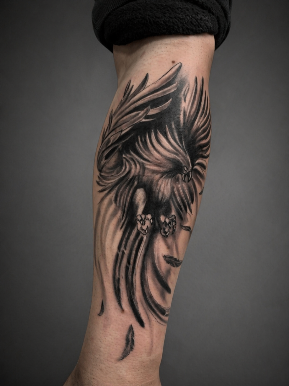 Black and grey eagle forearm tattoo by Rondon Neto